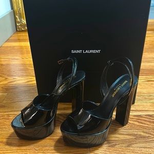 Saint Laurent platforms in parent leather. Work once for a photo shoot